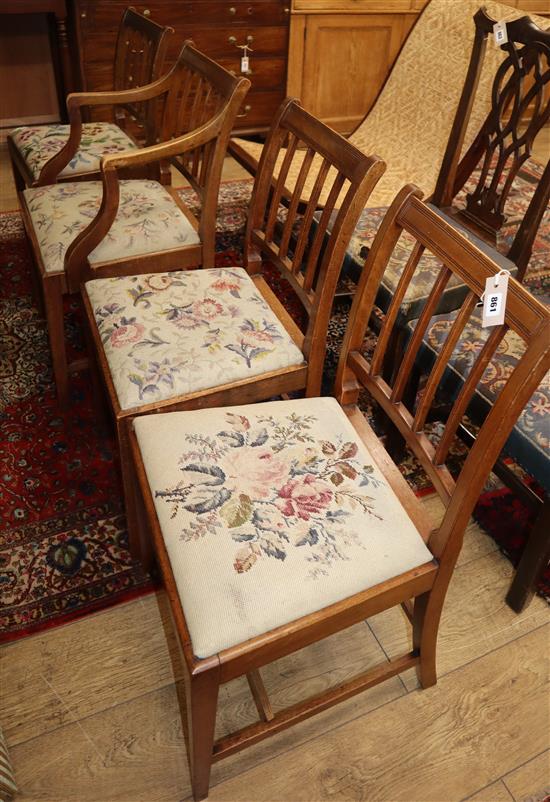 A set of four early 19th century mahogany rail back dining chairs (one arm, three single)